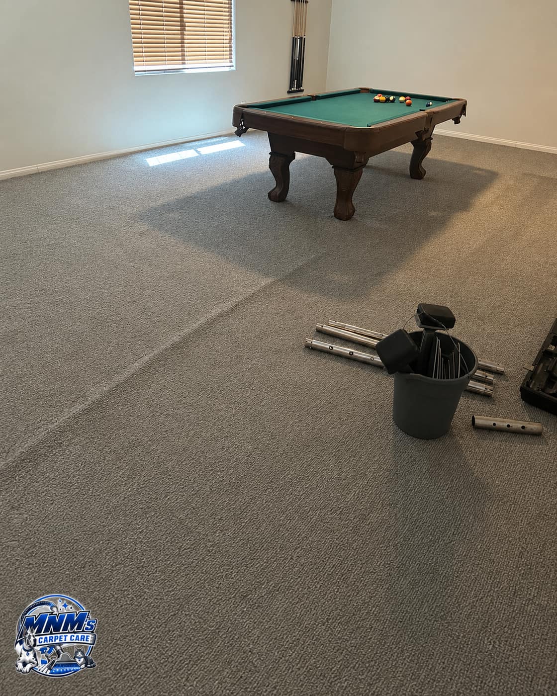 Carpet stretching tools in a game room